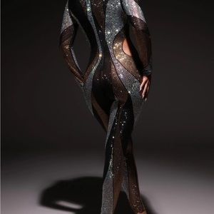 Incredible Luxe Jumpsuit. Lowered the price due to missing a little stones.